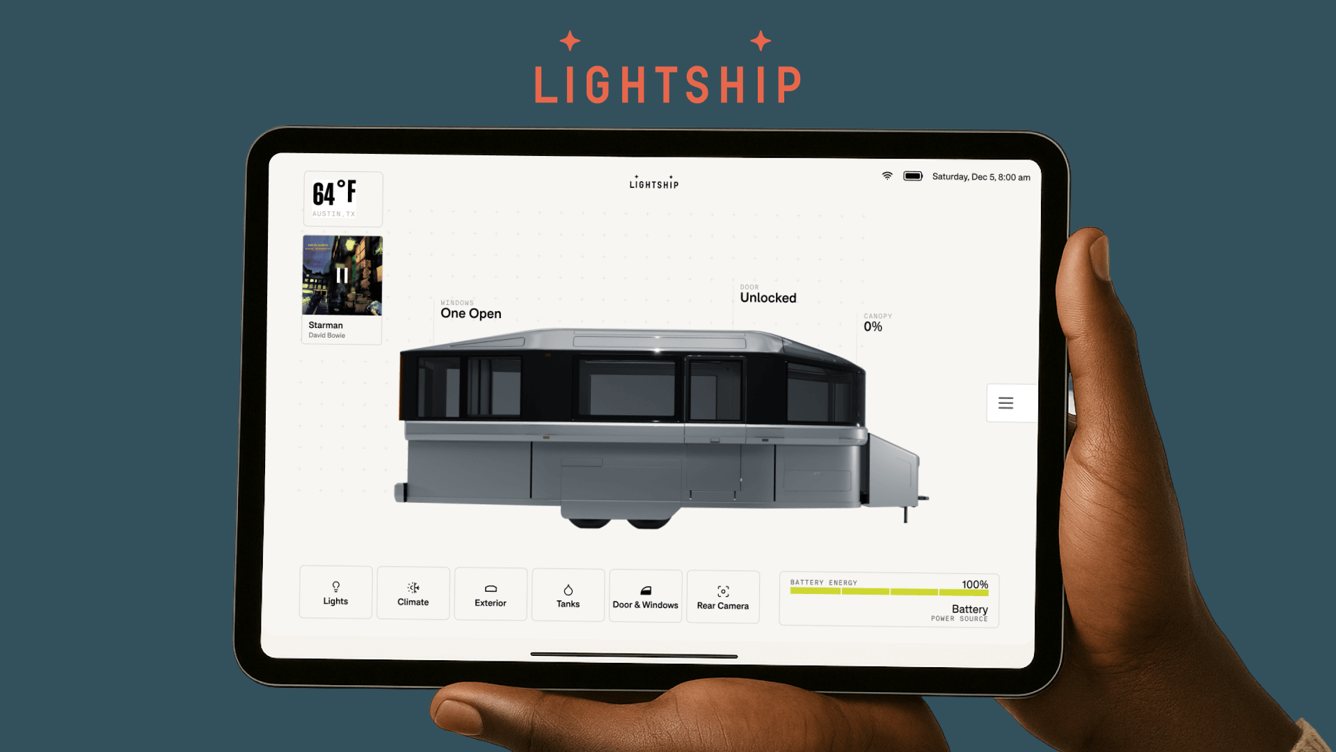 Hands holding tablet showing Lightship RV interface